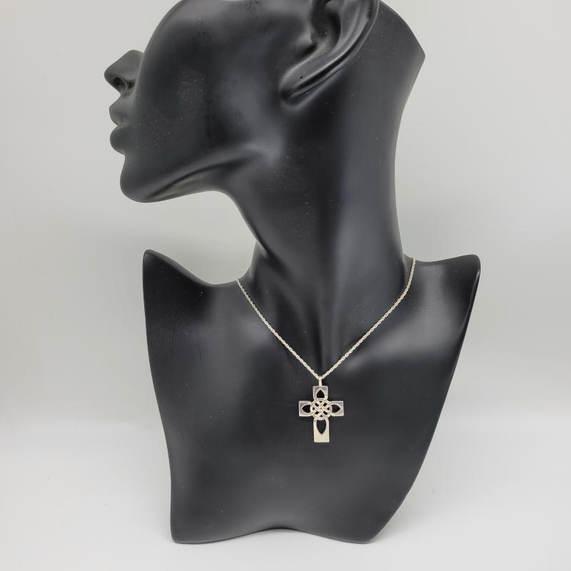A really thick and heavy vintage 925 silver Celtic cross pendant on a twisted rope style necklace. The pendant measures 2.4cm x 3.8cm, while the necklace measures 45cm in length. Fully hallmarked for Edinburgh 1983