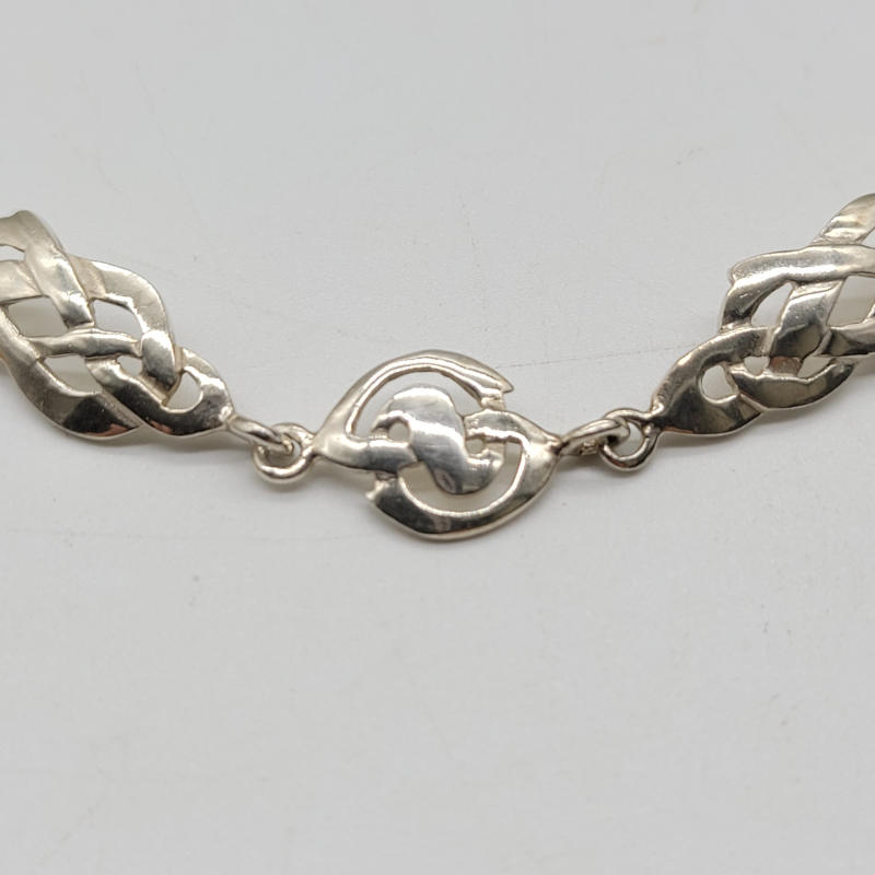 A lovely silver celtic necklace made by Kit Heath. Measures 42cm-45cm with an extra ring which makes it adjustable.
