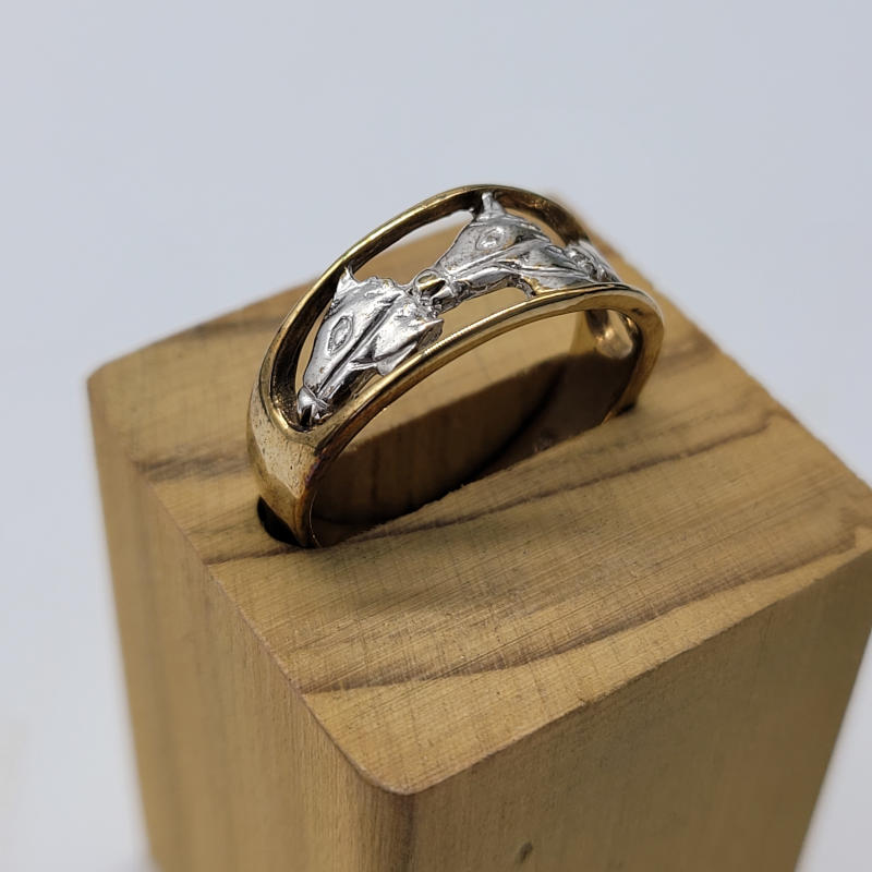 Triple Horse Head 2 Colour Gold Ring A 9ct yellow and white gold ring which has 3 horse's heads across the top. The horse heads are made in 9ct white gold while the band is made in 9ct yellow gold. UK Size M½ US Size 6½ Circumference 53mm