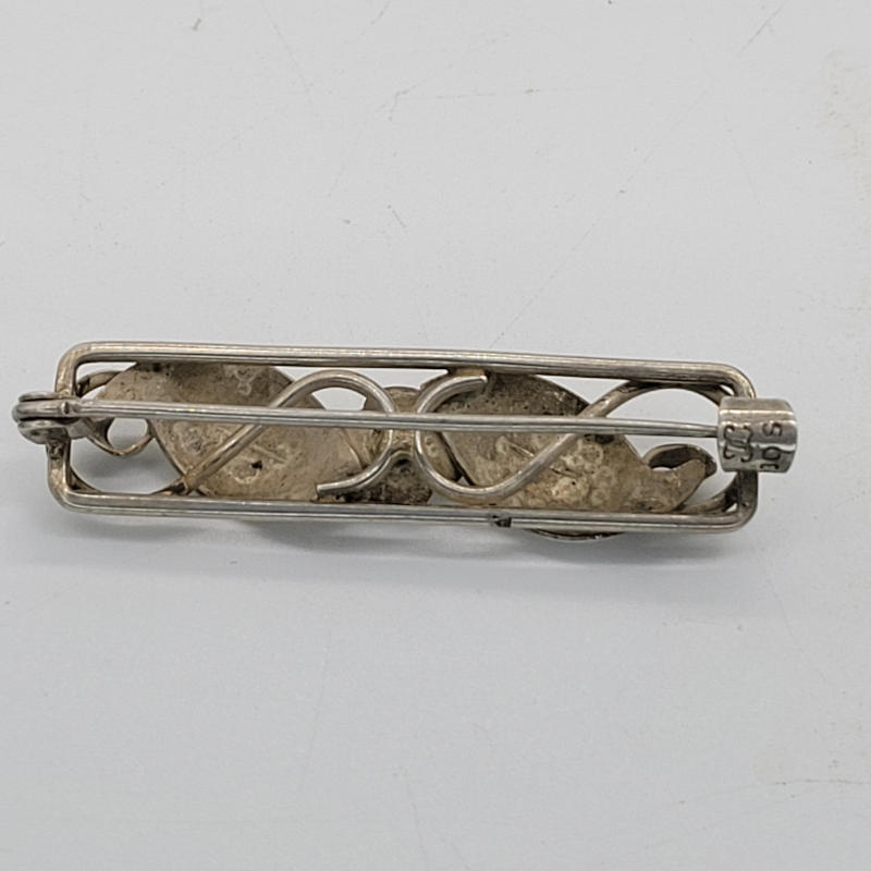 Vintage Danish Silver Brooch by John Lauritzen A Danish silver bar brooch with flowers and leaves. The brooch was made by Danish jeweller John Lauritzen and is in a modernist style. Measures 4.5cm x 1cm