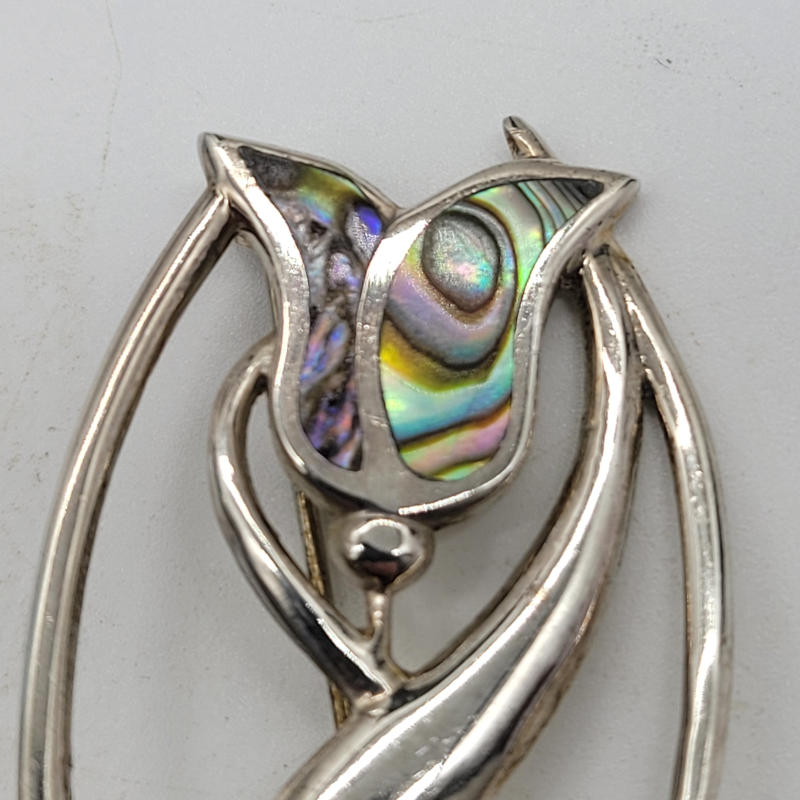 Large Art Nouveau Silver Abalone Brooch A large brooch which is art nouveau in style. It is made entirely in 925 silver with abalone shell panels for the flower petal decoration. Hallmarked PAM for Birmingham. It measures 2.7cm x 4.3cm